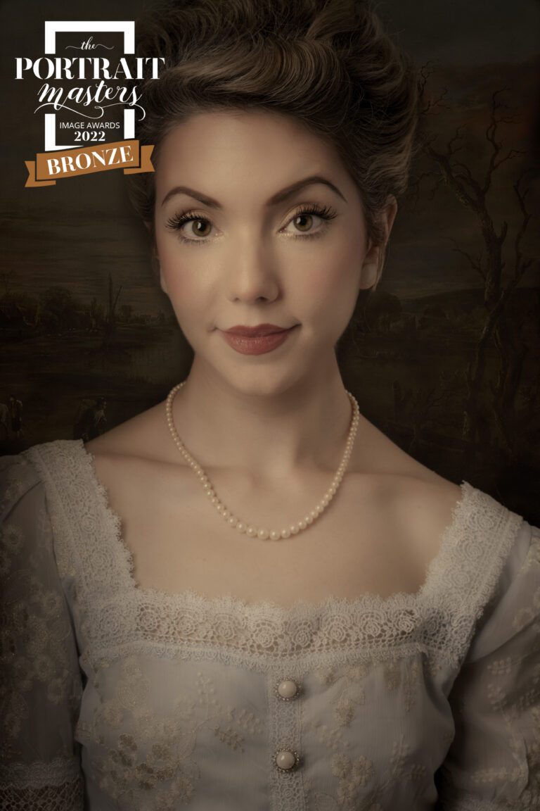Portrait of a woman in historical attire with a pearl necklace.