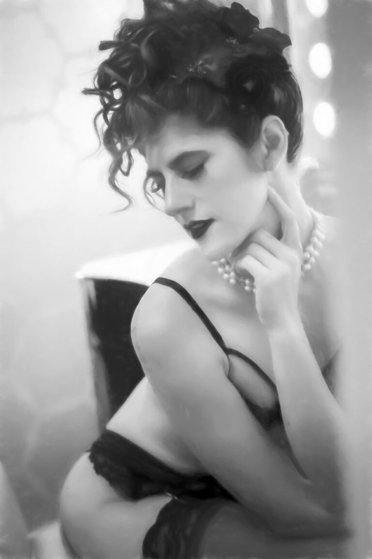 Black-and-white portrait of a woman with curly hair and expressive pose.
